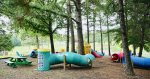 Playground in Nestled Under the Pine Trees